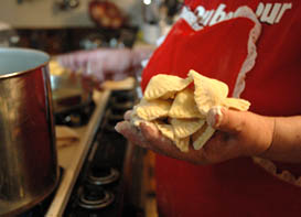 Dottie Naruszewicz Flanagan about to boil pierogi she has just made, Lowell, MA. Photo by Maggie Holtzberg.