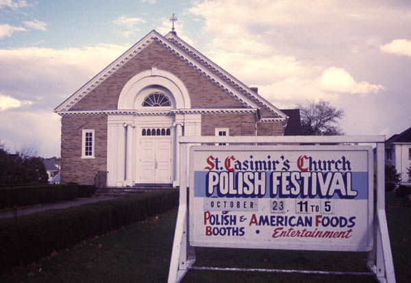 Exterior of church and signage, Ethnic festival, 1999; Saint Casimir Polish Festival; New Bedford, Massachusetts; Photography by Laura Orleans