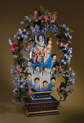 Little Statue, Italian American woodcarving, 1999; Charles M. Cerone (b. 1944); Nonantum, Massachusetts; Basswood, paint, iron, artificial flowers; 36 x 22 x 13 1/2 in. (statue); 37 x 22 x 22 in. (base); Collection of the artist; Photography by Jason Dowdle
