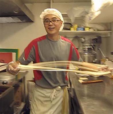 Chef Gene Wu hand-pulling Chinese noodles, Chinese food traditions, 2012; Gene Wu; Chelmsford, Massachusetts; Photography by Maggie Holtzberg