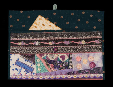 Cover for Afikomen, Jewish Passover textile, c. 2002; Lillian Goldberg (b. 1966); Canton, Massachusetts; Fabric, thread; 6 3/4 x 12 5/8 x 1/2 in. buttoned; Collection of the artist; Photography by Jason Dowdle
