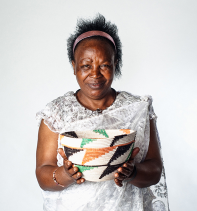 Portrait of Patrisiya Kayobera by Stephen King, Worcester Magaze, Rwandan basket weaving, 2015; Patrisiya Kayobera; Worcester, Massachusetts; Unravelled rice bag rewoven as basket;