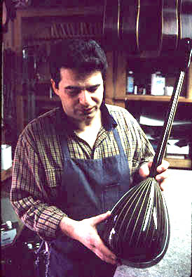 Chris Pantezelos with a bouzuki, luthier: bouzouki making, 1999; Belmont, Massachusetts;