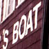 Lowell's Boat Shop sign through window; Wooden boat building; 2003: 