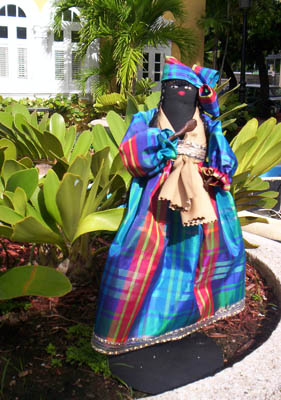 Festive African Doll; Apprenticeship - Puerto Rican doll making; 2007: Ashland, Massachusetts; Silk, wire, thread; 12 in.