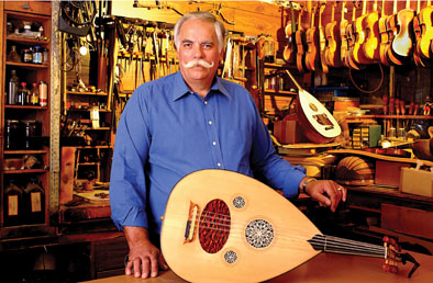 Peter Kyvelos with oud in his shop, Unique Strings, Belmont, Massachusetts: 2004: Wood, plastic, mother-of-pearl, strings