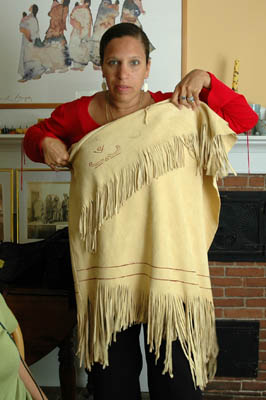 Michelle Fernandes holding up shawl with fringe. Photography by Russel Call; Apprenticeship - Native regalia; 2006: West Barnstable, Massachusetts
