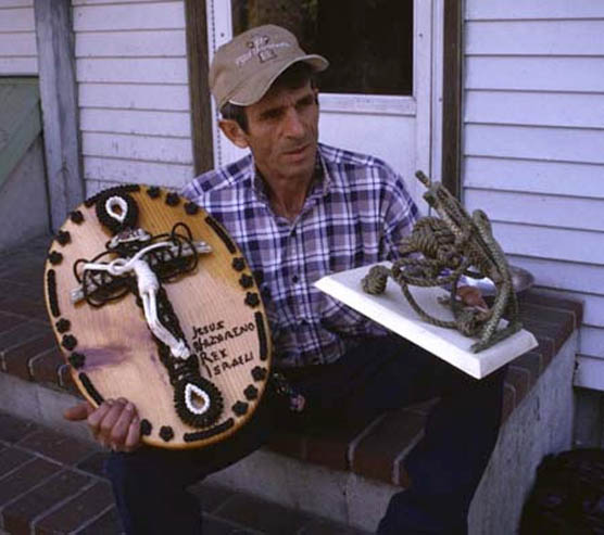 Marco Randazzo on his back steps with two of his pieces; Rope sculpture; 2000: Gloucester, Massachusetts; wood, fishing line
