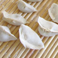 Dumplings ready for cooking and bowl of filling; Foodways; 2014: Lowell, Massachusetts