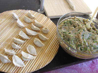 Dumplings ready for cooking and bowl of filling; Foodways; 2014: Lowell, Massachusetts