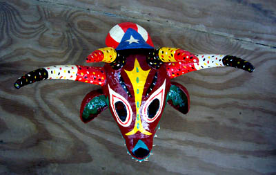 Four horned mask made by apprentice Anthony Paul Martinez; Apprenticeship - Puerto Rican carnival mask making; 2008: Holyoke, Massacusetts; Painted papier mâché