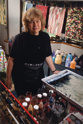 Genie St. John in her marbling studio; Paper marbling; 2014: Amherst, Massachusetts